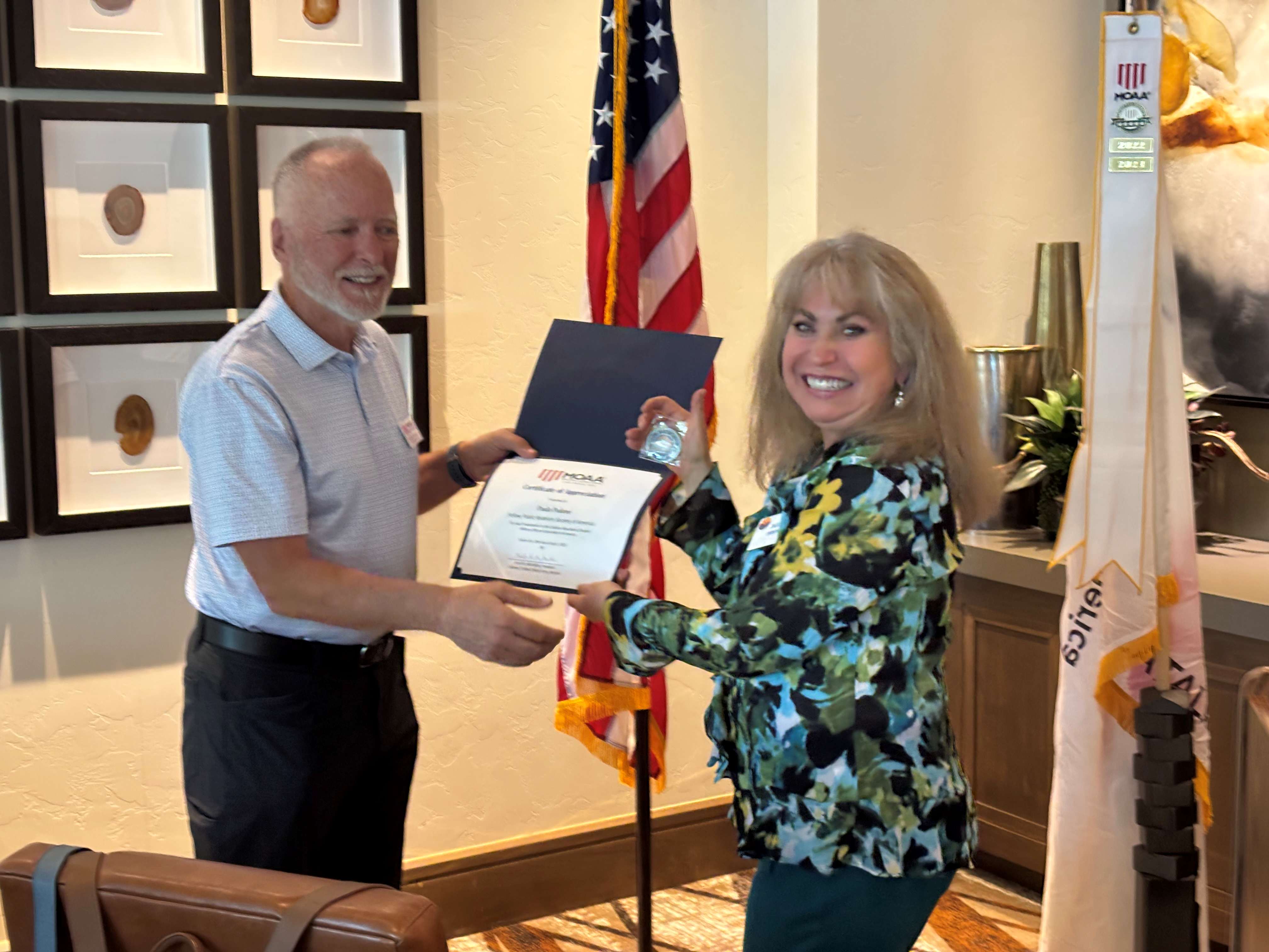 Paula Pedene receipt of certificate at April 2025 luncheon